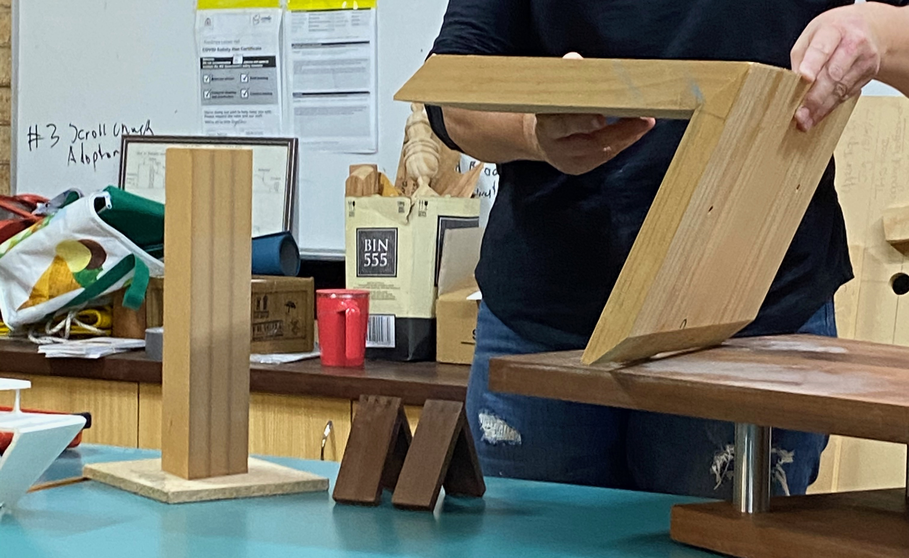 Photo of Carolyn demonstrating the prototype leg joinery
