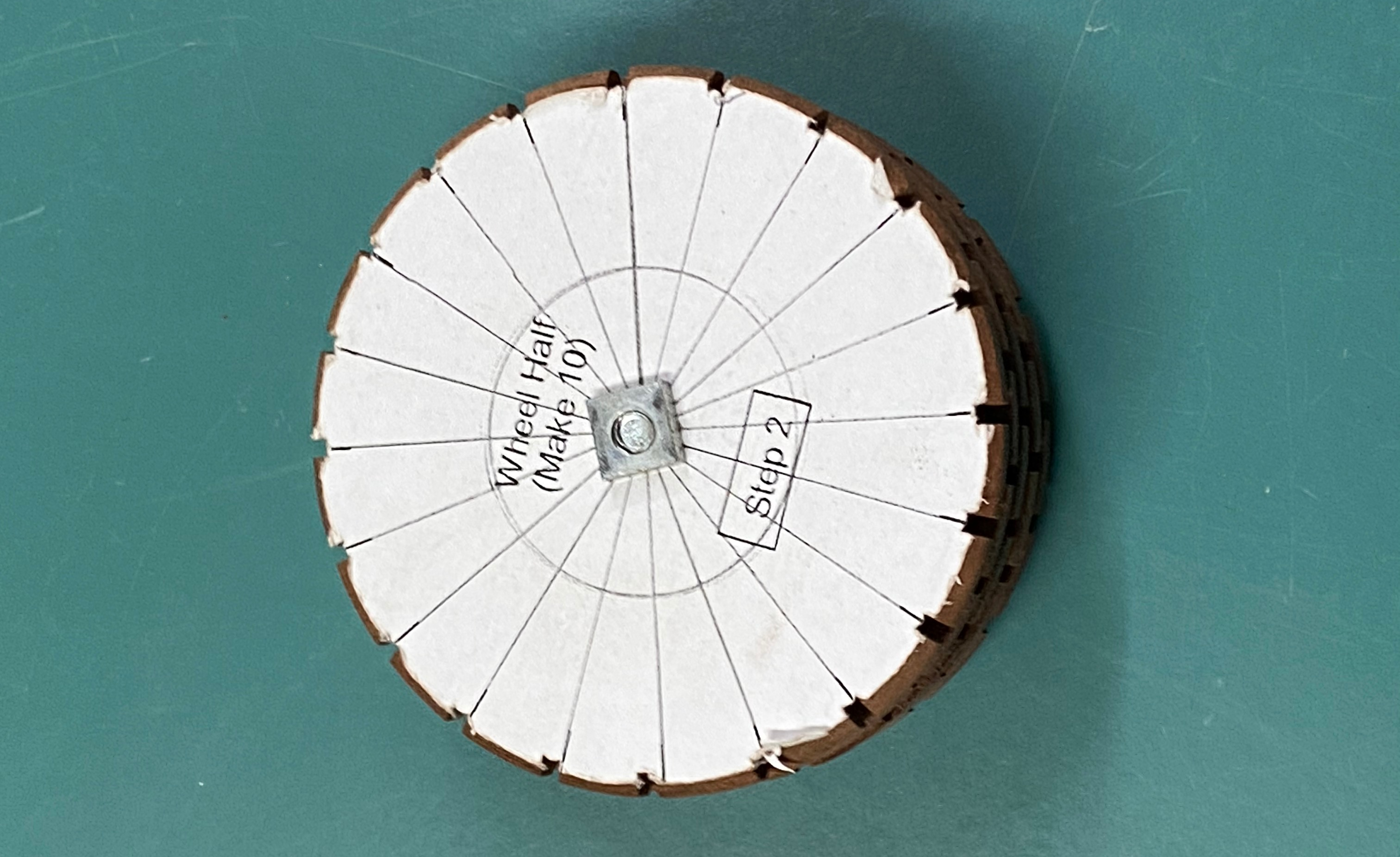 Photo of a wheel groove template showing were to cut the grooves