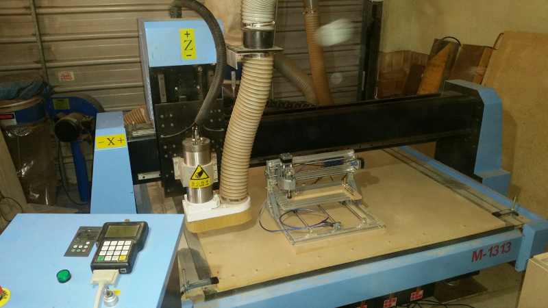 Photo of Roger's full sized CNC machine with the miniature CNC for comparison