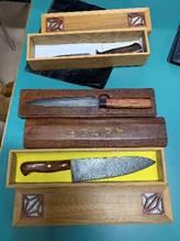 Picture showing the knives made by the speaker in their display boxes