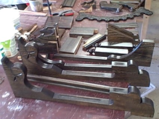 Photo of upper case parts drying after staining and varnishing
