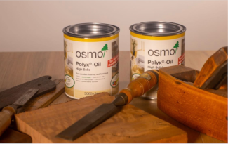 Image showing two cans of Osmo oil with some wood working tools